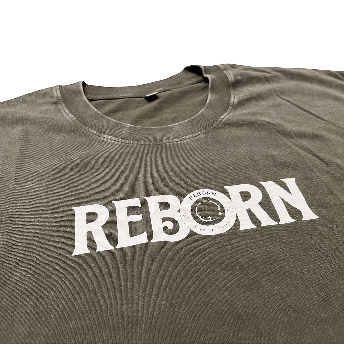 Live In Faith REBORN faded olive green cotton t-shirt with white text logo on chest.